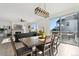 Bright dining area with wooden table and chairs, leading to a deck at 1030 W Hopkins Dr, Elizabeth, CO 80107