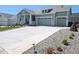 Charming two-story home boasts a spacious driveway and a two-car garage, perfect for modern living at 1030 W Hopkins Dr, Elizabeth, CO 80107