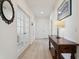 Bright hallway with hardwood floors and a console table at 1030 W Hopkins Dr, Elizabeth, CO 80107