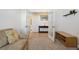 Bright living room with French doors and a view into another room at 1030 W Hopkins Dr, Elizabeth, CO 80107