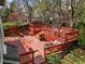 Multi-level red stained backyard deck perfect for outdoor entertaining at 5723 S Everett Way, Littleton, CO 80123