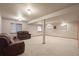 Spacious basement area with comfortable seating and lots of natural light at 5723 S Everett Way, Littleton, CO 80123