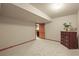 Bedroom with carpet, a wood door and a view into another room at 5723 S Everett Way, Littleton, CO 80123