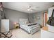 Comfortable bedroom with neutral walls, ceiling fan, and lots of natural light at 5723 S Everett Way, Littleton, CO 80123