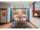 Bright dining area with a skylight and a view of the outdoor deck, perfect for entertaining at 5723 S Everett Way, Littleton, CO 80123