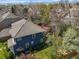 Back exterior of home showcasing backyard deck and mature landscaping at 5723 S Everett Way, Littleton, CO 80123