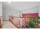 Bright hallway with view of brick fireplace and lower level living area at 5723 S Everett Way, Littleton, CO 80123