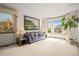 Bright and airy living room with large windows, plush carpeting, and stylish neutral decor at 5723 S Everett Way, Littleton, CO 80123