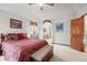 Comfortable bedroom with a decorative ceiling fan and an en-suite bathroom at 5723 S Everett Way, Littleton, CO 80123