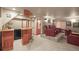 Basement theater room featuring a wet bar and comfortable leather seating at 5723 S Everett Way, Littleton, CO 80123