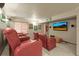 Finished basement theater room with recliner seating and flat screen TV at 5723 S Everett Way, Littleton, CO 80123