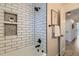 Bright bathroom featuring subway tile in the shower and hallway access at 649 Nucla Way, Aurora, CO 80011