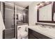 Modern bathroom featuring a glass shower enclosure and contemporary fixtures at 649 Nucla Way, Aurora, CO 80011