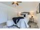 Cozy bedroom with a padded headboard, soft carpet, and well-lit lamps at 649 Nucla Way, Aurora, CO 80011