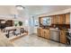 View of the kitchen, dining room and living room in an open concept floor plan at 649 Nucla Way, Aurora, CO 80011