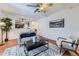 Open-concept living room with a view into the kitchen, showcasing modern design at 649 Nucla Way, Aurora, CO 80011