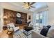 Inviting living room features a brick fireplace, hardwood floors, and sliding glass doors at 649 Nucla Way, Aurora, CO 80011