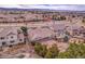 Expansive aerial view of a suburban home featuring a landscaped backyard, community, and distant mountain views at 2342 Bellavista St, Castle Rock, CO 80109