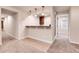 Basement featuring a wet bar, neutral carpet, and paint with access to the utility room at 2342 Bellavista St, Castle Rock, CO 80109