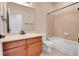 Cozy bathroom featuring tile floors, a shower-tub combo, and a wood vanity at 2342 Bellavista St, Castle Rock, CO 80109