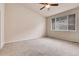 Spacious bedroom with a ceiling fan and large window providing natural light at 2342 Bellavista St, Castle Rock, CO 80109