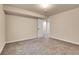 Neutral bedroom with carpeted flooring, neutral paint, and a doorway that leads into the hallway at 2342 Bellavista St, Castle Rock, CO 80109