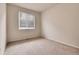 Cozy bedroom with neutral walls and carpet with a window for natural light at 2342 Bellavista St, Castle Rock, CO 80109