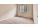 Empty bedroom showcasing a light beige color palette and a bright window at 2342 Bellavista St, Castle Rock, CO 80109