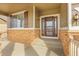 Inviting front porch with stone accents and a decorative front door creating a welcoming entrance at 2342 Bellavista St, Castle Rock, CO 80109