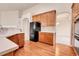 Bright kitchen with light countertops, hardwood floors, wooden cabinets and stainless appliances at 2342 Bellavista St, Castle Rock, CO 80109