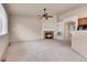 Comfortable living room with a fireplace, ceiling fan, and neutral carpeting, perfect for relaxation at 2342 Bellavista St, Castle Rock, CO 80109