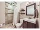 Clean bathroom with shower/tub combo and updated vanity at 209 S Pembrook St, Castle Rock, CO 80104