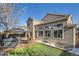 Home exterior showcasing backyard deck and landscaping at 209 S Pembrook St, Castle Rock, CO 80104