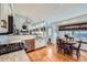 Modern kitchen with white cabinets, stainless steel appliances, and granite countertops at 209 S Pembrook St, Castle Rock, CO 80104