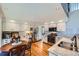 Bright kitchen with white cabinets, stainless steel appliances, and granite countertops at 209 S Pembrook St, Castle Rock, CO 80104