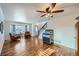 Bright living room with hardwood floors, comfy chairs, and a vintage jukebox at 209 S Pembrook St, Castle Rock, CO 80104