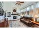 Spacious living room with a fireplace, hardwood floors, and large windows at 209 S Pembrook St, Castle Rock, CO 80104