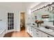 Elegant main bathroom with double vanity, soaking tub, and shower at 209 S Pembrook St, Castle Rock, CO 80104