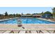 Community swimming pool with lounge chairs at 209 S Pembrook St, Castle Rock, CO 80104