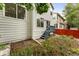 View of the backyard featuring a small deck and some lawn at 1241 S Akron Way, Denver, CO 80247