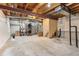 Unfinished basement with utilities, exposed beams, and ample room for customization at 1241 S Akron Way, Denver, CO 80247