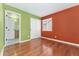Bedroom with hardwood floors, a large closet, and an adjoining bathroom at 1241 S Akron Way, Denver, CO 80247