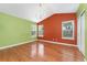 Bright bedroom featuring a vaulted ceiling, hardwood floors and large windows providing ample natural light at 1241 S Akron Way, Denver, CO 80247
