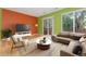 Bright living room boasts hardwood floors, and sliding door access to a private balcony at 1241 S Akron Way, Denver, CO 80247