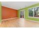 Bright and open living room featuring sliding glass doors to a private balcony at 1241 S Akron Way, Denver, CO 80247