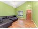 Large open living area featuring vaulted ceilings, a chandelier, and a dark leather sofa at 1241 S Akron Way, Denver, CO 80247