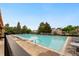 Large community pool featuring many lounge chairs at 1241 S Akron Way, Denver, CO 80247