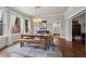 Charming dining room featuring hardwood floors, abundant natural light, and seamless access to the kitchen and living areas at 5675 S Crocker St, Littleton, CO 80120