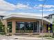 Exterior view of Bacon Social House with large windows, and outdoor seating area at 5675 S Crocker St, Littleton, CO 80120