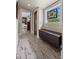 Bright hallway with unique wood-look flooring and a decorative stained-glass window, adding character at 5675 S Crocker St, Littleton, CO 80120